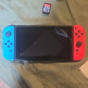 Nintendo Switch with Neon Blue Left Joy‑Con and Neon Red Right Joy‑Con